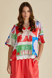 A model wearing the Scarlett Shirt in colour Seashell, from the front, cropped image