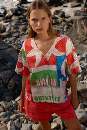A model wearing the Scarlett Shirt in colour Seashell, from the front, showing the whole outfit