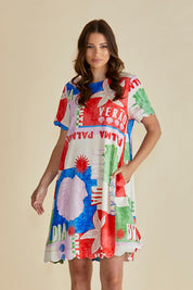 A model wearing the Dawn Shift Dress in colour Seashell, from the front, cropped image