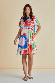 A model wearing the Dawn Shift Dress in colour Seashell, from the front, showing the whole outfit