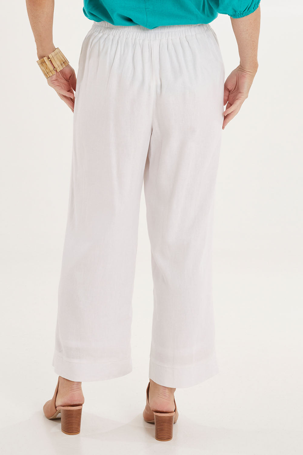 Model Sally wearing size 10 of the Parker Pant in colour White (White), from the back
