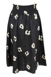 Product shot of the Reagan Cotton Poplin Skirt in colour Leopard (Black), from the back