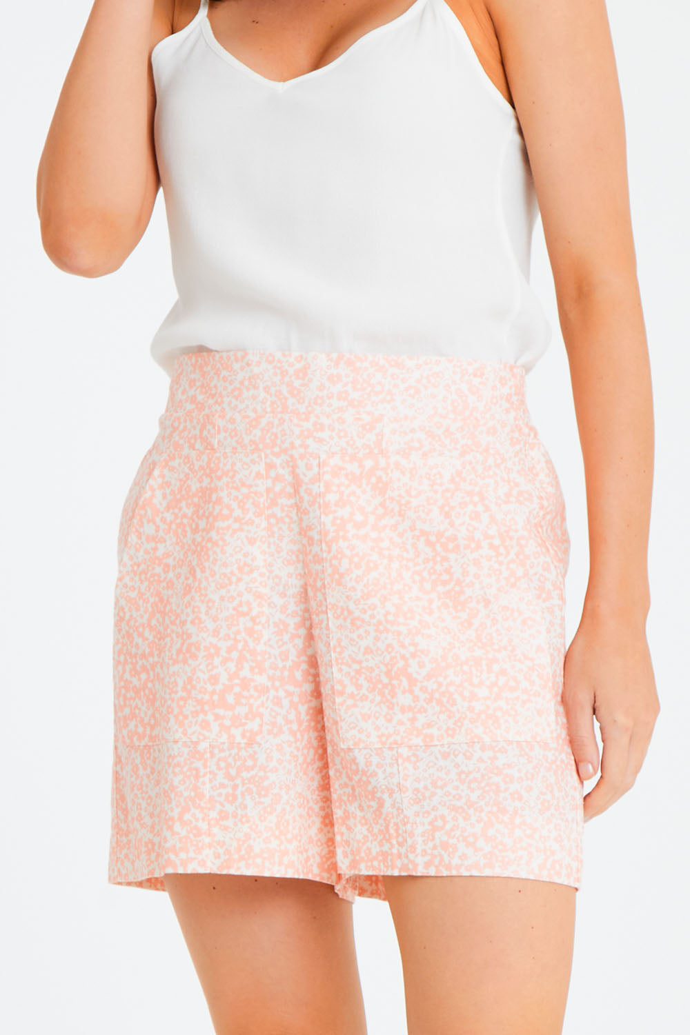 Model Andrea wearing size 10 of the Peyton Short in colour Fleur (Pink), from the front, cropped image
