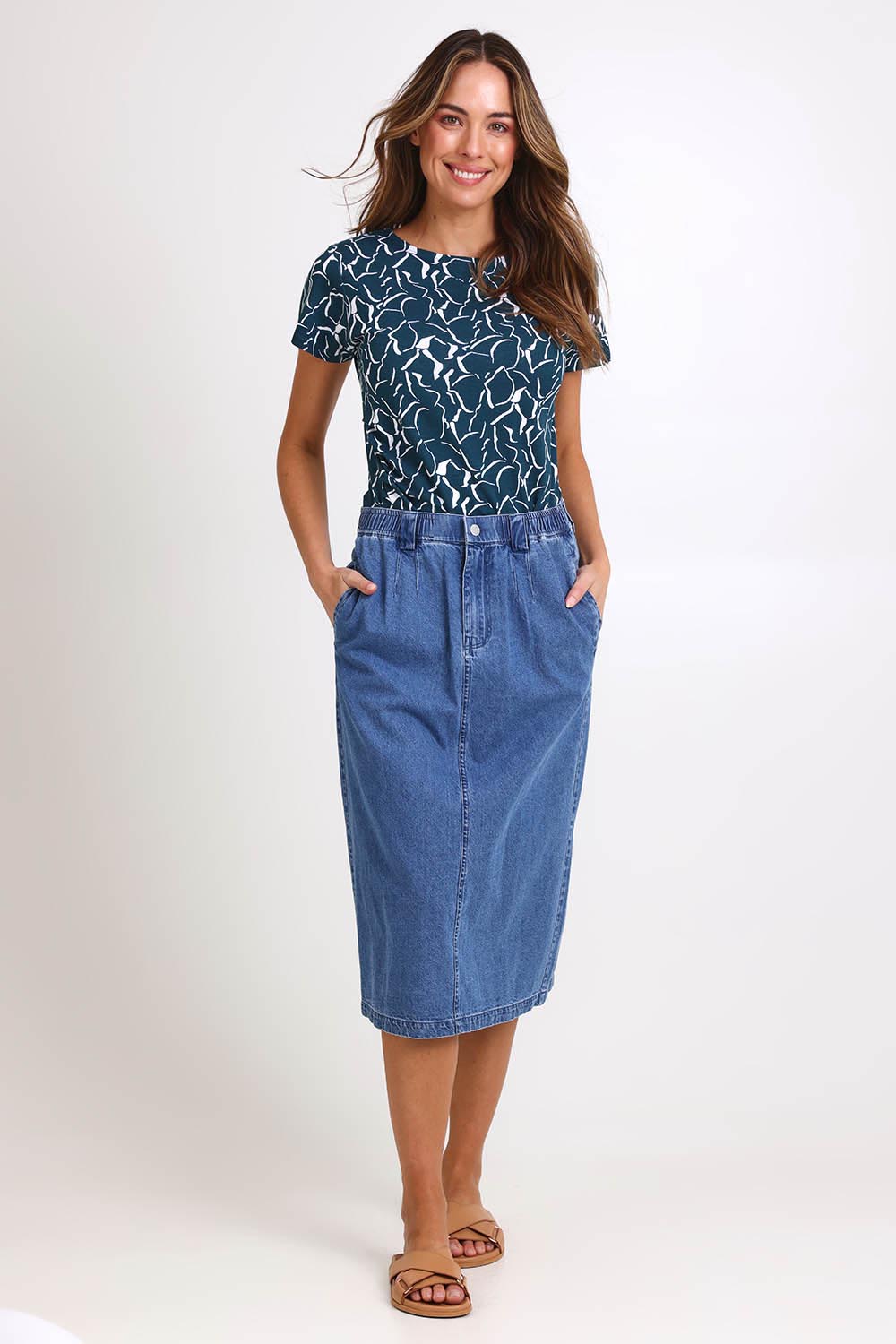 Model Madelinec wearing size 10 of the Solange Midi Denim Skirt – Medwash in colour Medwash, from the front