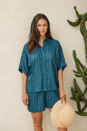 Model Genericm wearing size sample of the Ophelia Shirt – Teal in colour Teal, in a cropped view
