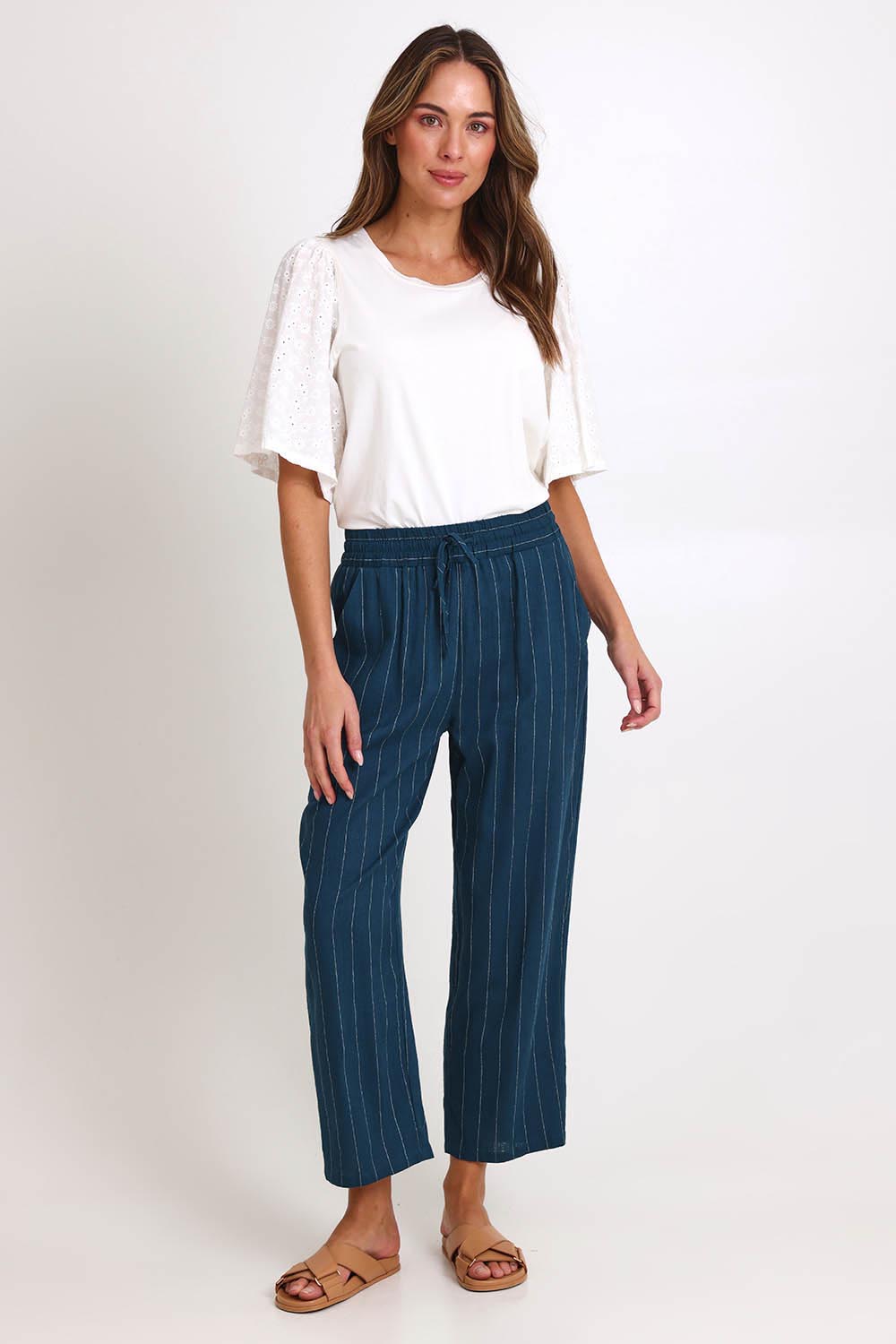 Model Madelinec wearing size 10 of the Palm Relax Pants – Teal in colour Teal, from the front