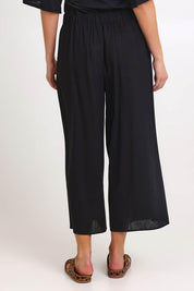 Model Madelinec wearing size 10 of the Bella Crop Pants – Black in colour Black, from the back