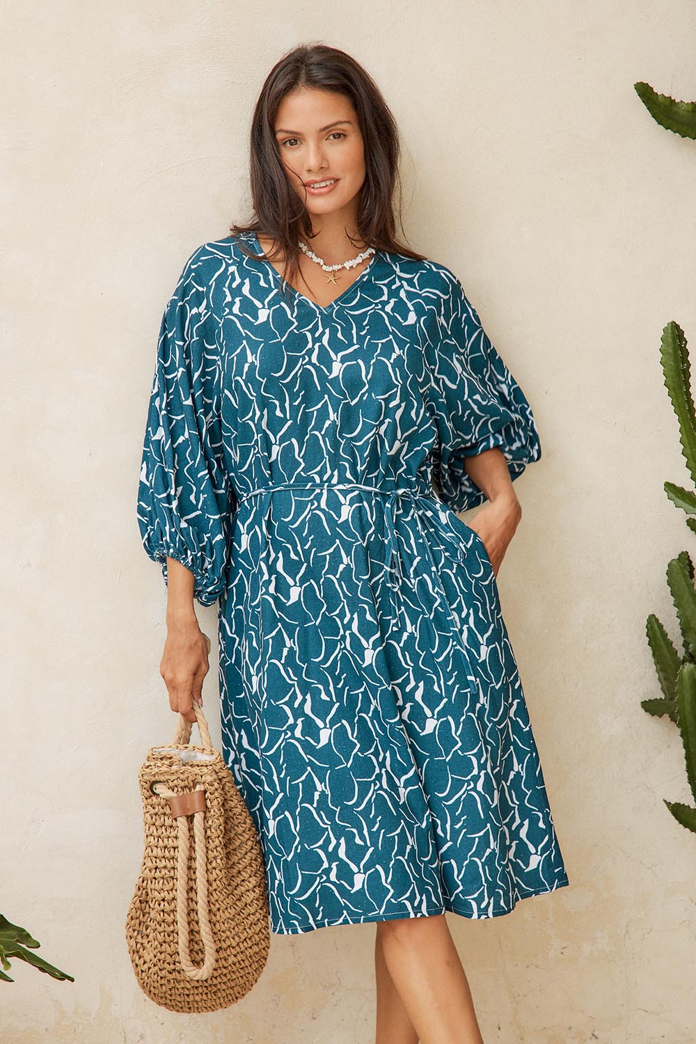 Model Genericm wearing size sample of the Bella Dress – Teal in colour Teal, from the front