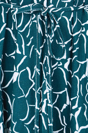 Product shot of the Bella Dress – Teal in colour Teal, showing detail