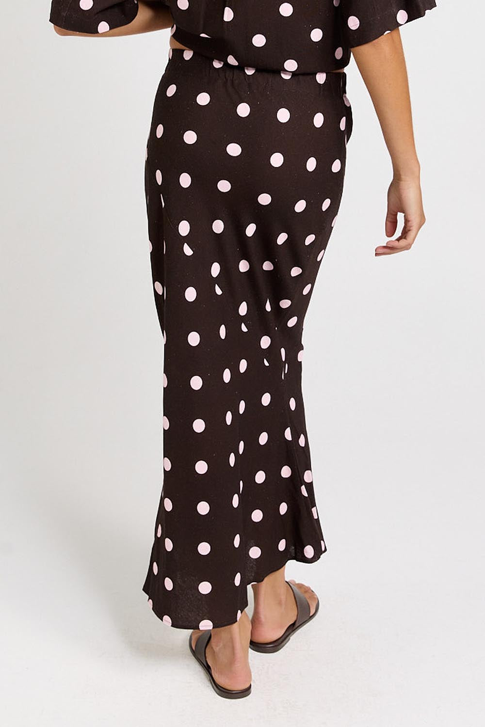 Model Genericm wearing size sample of the Sable Bias Yoke Skirt – Pinkchoc in colour Pinkchoc, from the back