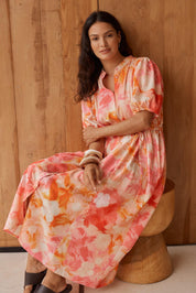 Model Genericm wearing size sample of the Nia Dress – Floral in colour Floral, from the front