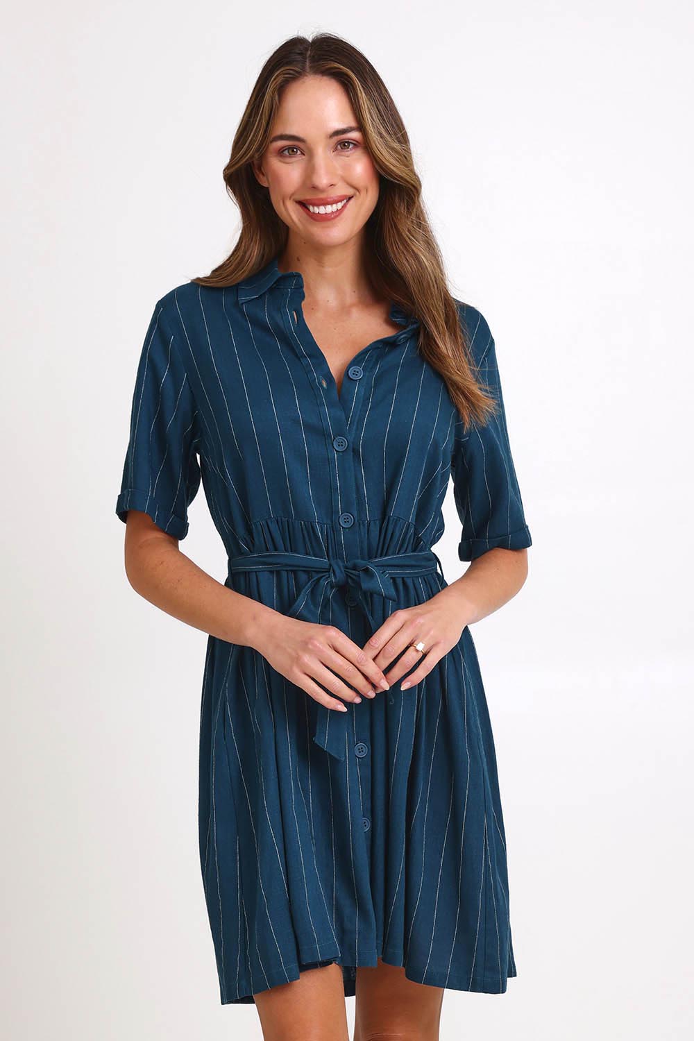 Model Madelinec wearing size 10 of the Palm Shirt Dress – Teal in colour Teal, in a cropped view