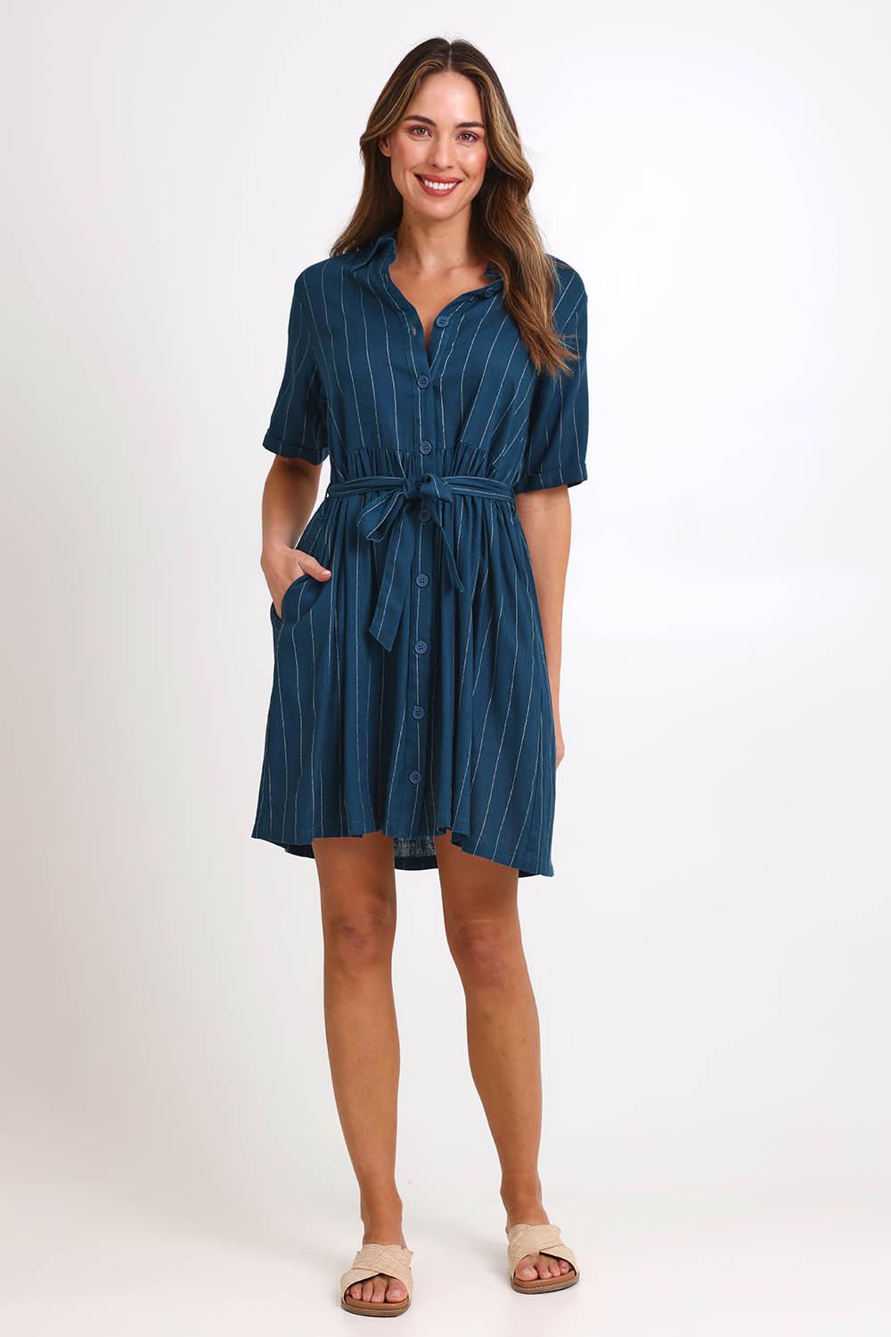 Model Madelinec wearing size 10 of the Palm Shirt Dress – Teal in colour Teal, from the front