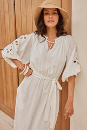 Model Genericm wearing size sample of the Daisy Broderie Dress - White in colour White, from an angle
