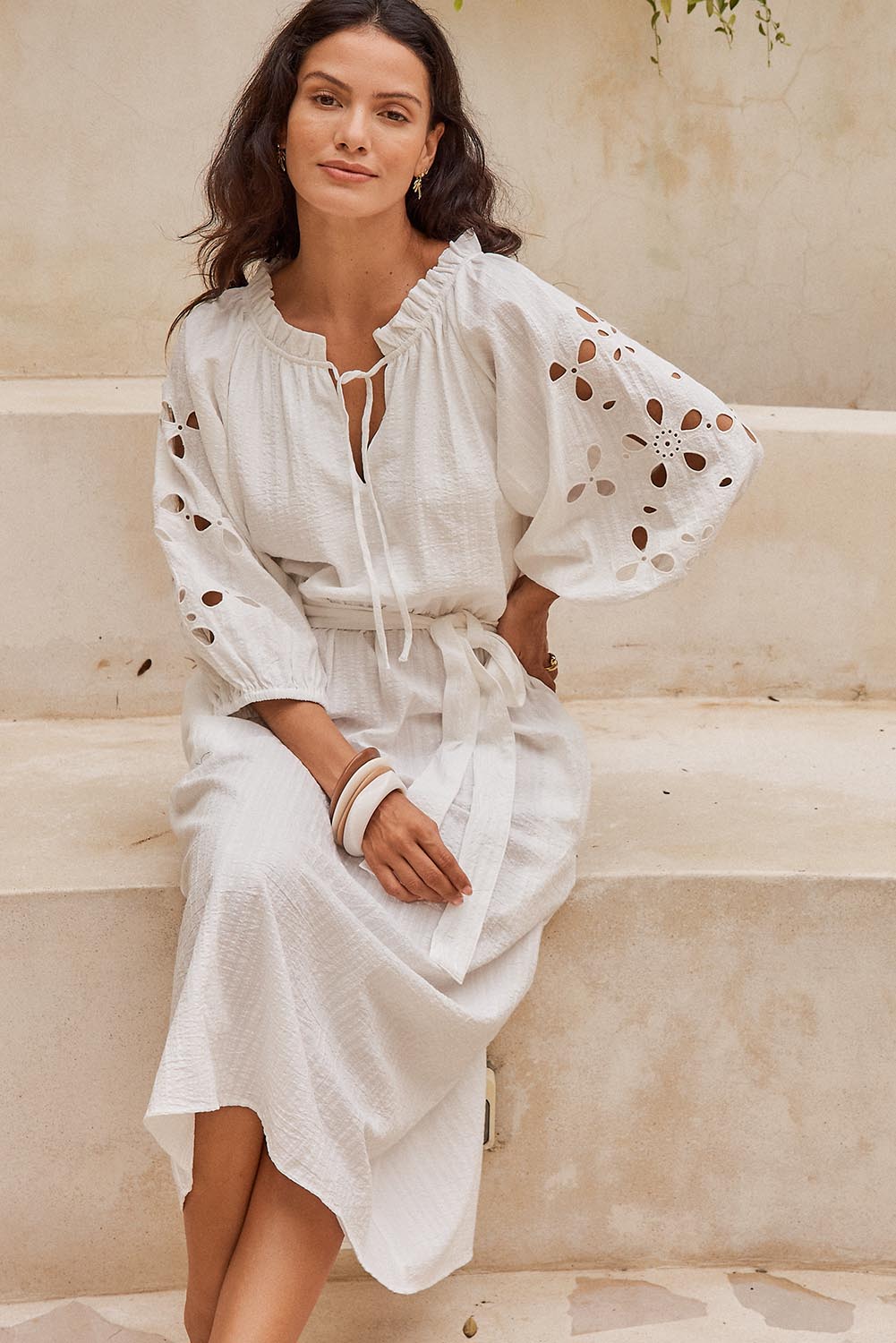 Model Genericm wearing size sample of the Nia Dress – White in colour White, in a cropped view