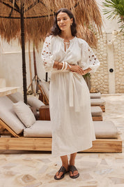 Model Genericm wearing size sample of the Nia Dress – White in colour White, from the front