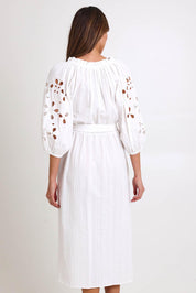 Model Madelinec wearing size 10 of the Daisy Broderie Dress - White in colour White, from the back