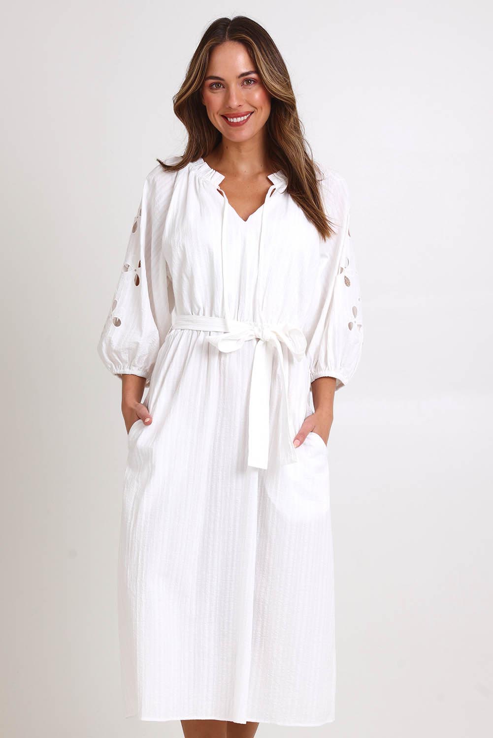 Model Madelinec wearing size 10 of the Nia Dress – White in colour White, in a cropped view