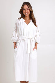 Model Madelinec wearing size 10 of the Nia Dress – White in colour White, in a cropped view