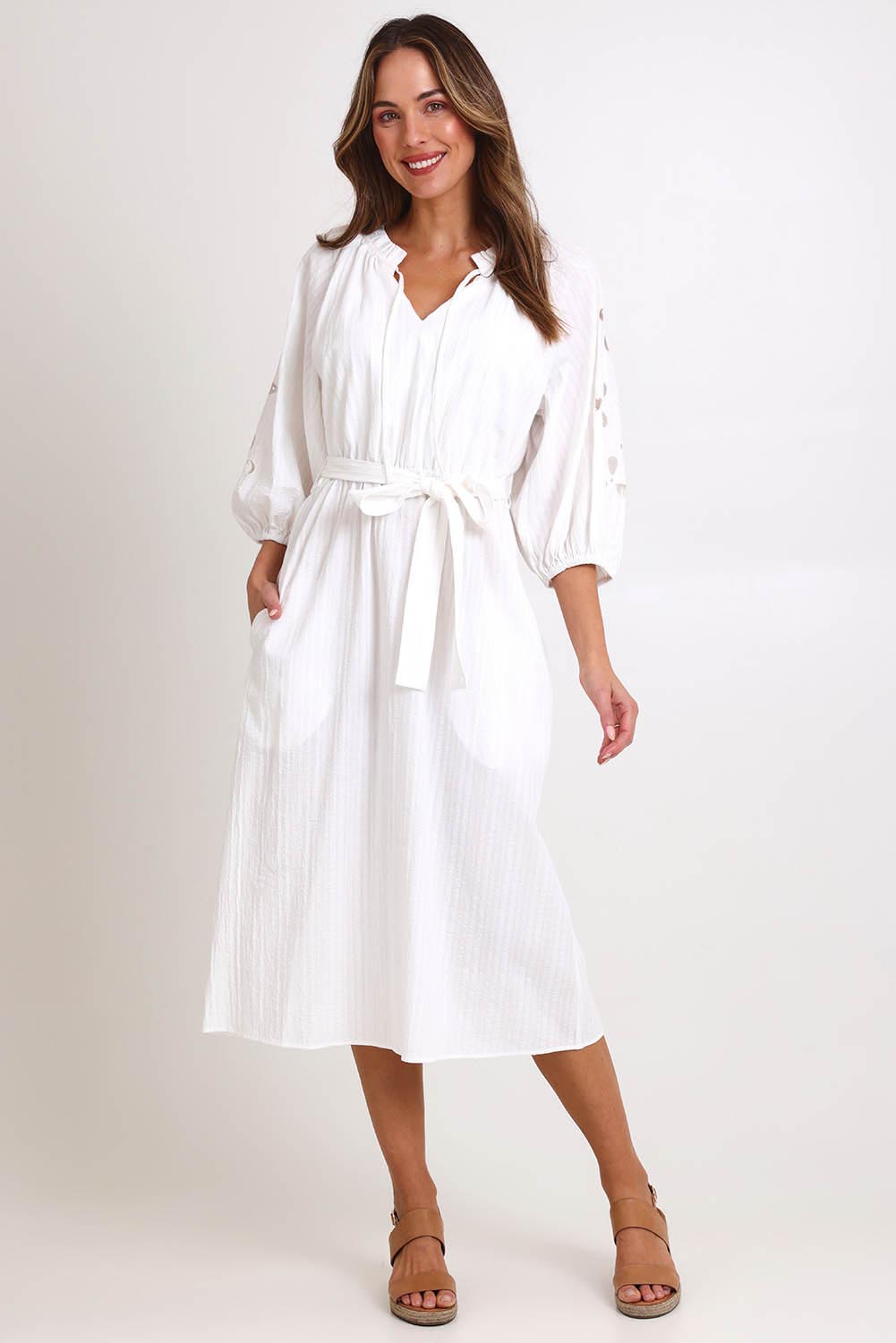 Model Madelinec wearing size 10 of the Daisy Broderie Dress - White in colour White, from the front