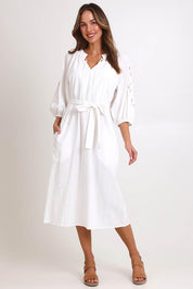 Model Madelinec wearing size 10 of the Daisy Broderie Dress - White in colour White, from the front