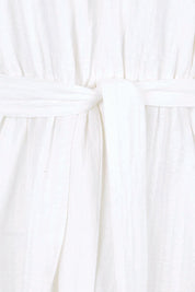Product shot of the Daisy Broderie Dress - White in colour White, showing detail