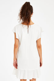 Model Courtney wearing size 10 of the Maree Dress in colour White (White), from the back
