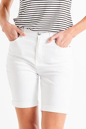 A model wearing the Bonnie Bermuda Denim Short in colour White (White), from the front, cropped image