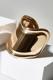 A model wearing size OneSize of the High Shine Cuff in colour Goldplated (Metallics), from the front, showing the whole outfit
