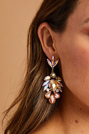 A model wearing size OneSize of the Glass Cluster Earrings in colour Champagne, from the front, showing the whole outfit