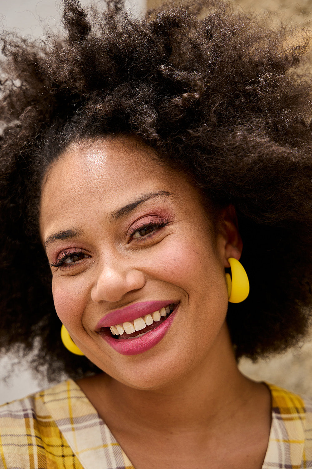 Model Olivia wearing size OneSize of the Coloured Hoop Earrings in colour Yellow, from the front, showing the whole outfit