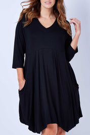 Model Laura wearing size 12 of The Pocket Tunic Dress in colour Black (Black), from the front, cropped image