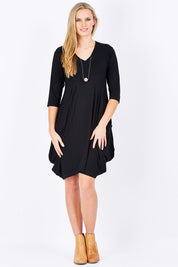 Model Maddy wearing size 10 of The Pocket Tunic Dress in colour Black (Black), from the front, showing the whole outfit