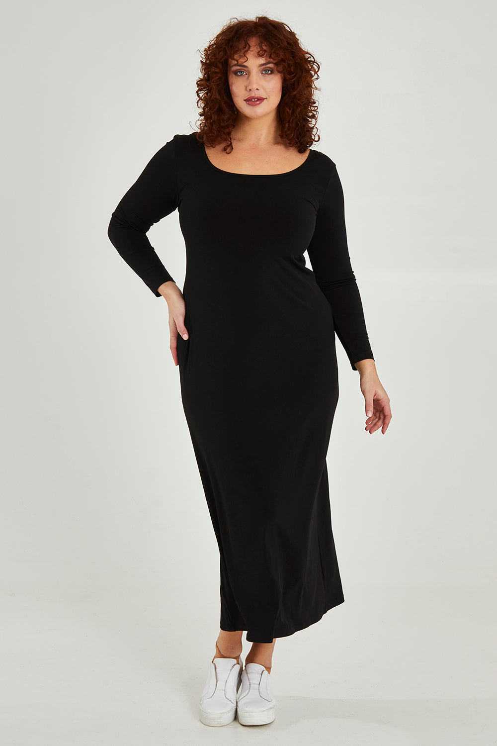 Model Maddy wearing size 16 of The Long Sleeve Comfort Maxi in colour Black (Black), from the front, showing the whole outfit