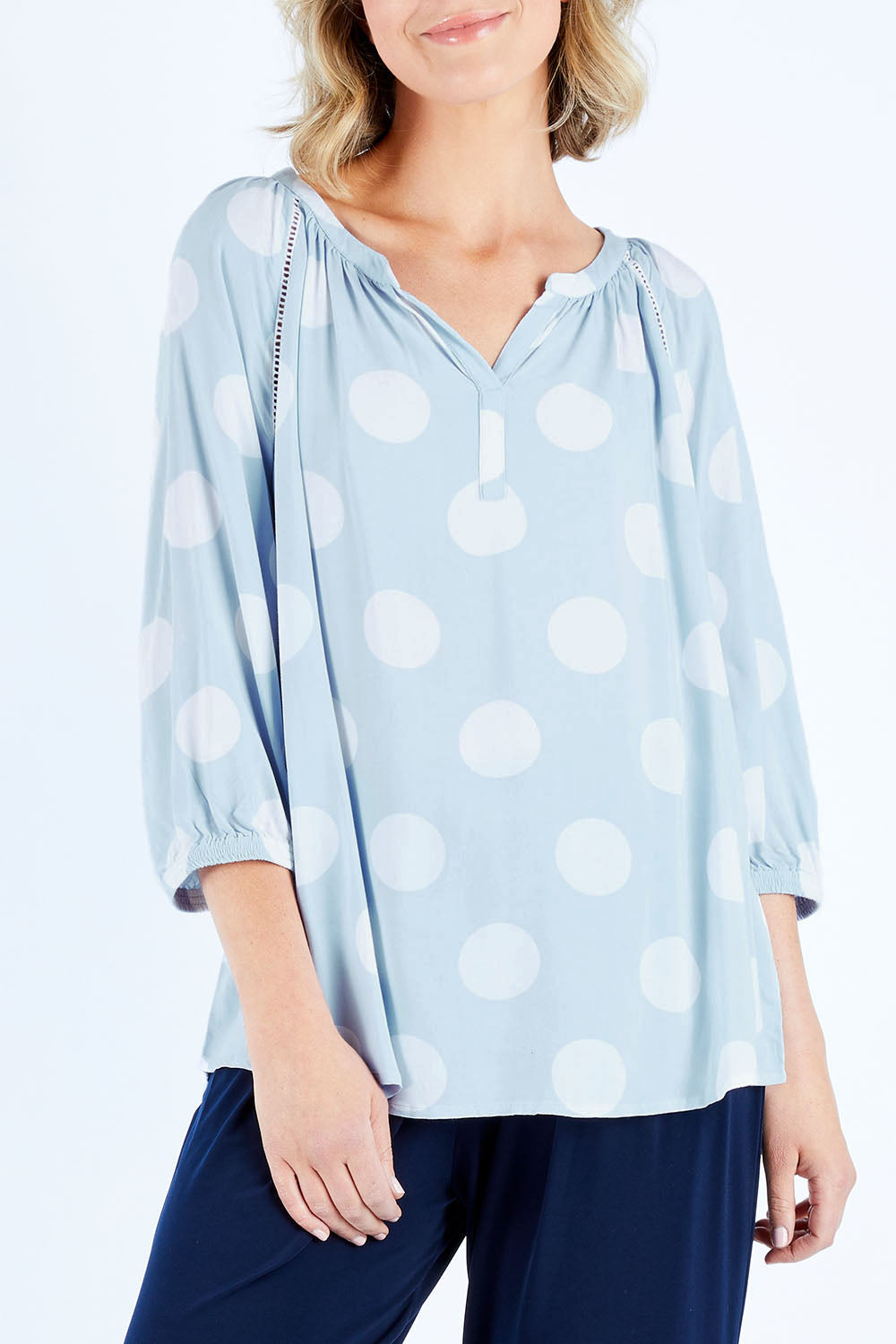 Model Chelsea wearing size 10 of The Stitch Detail Blouse in colour Chambspot (Blue), from the front, cropped image