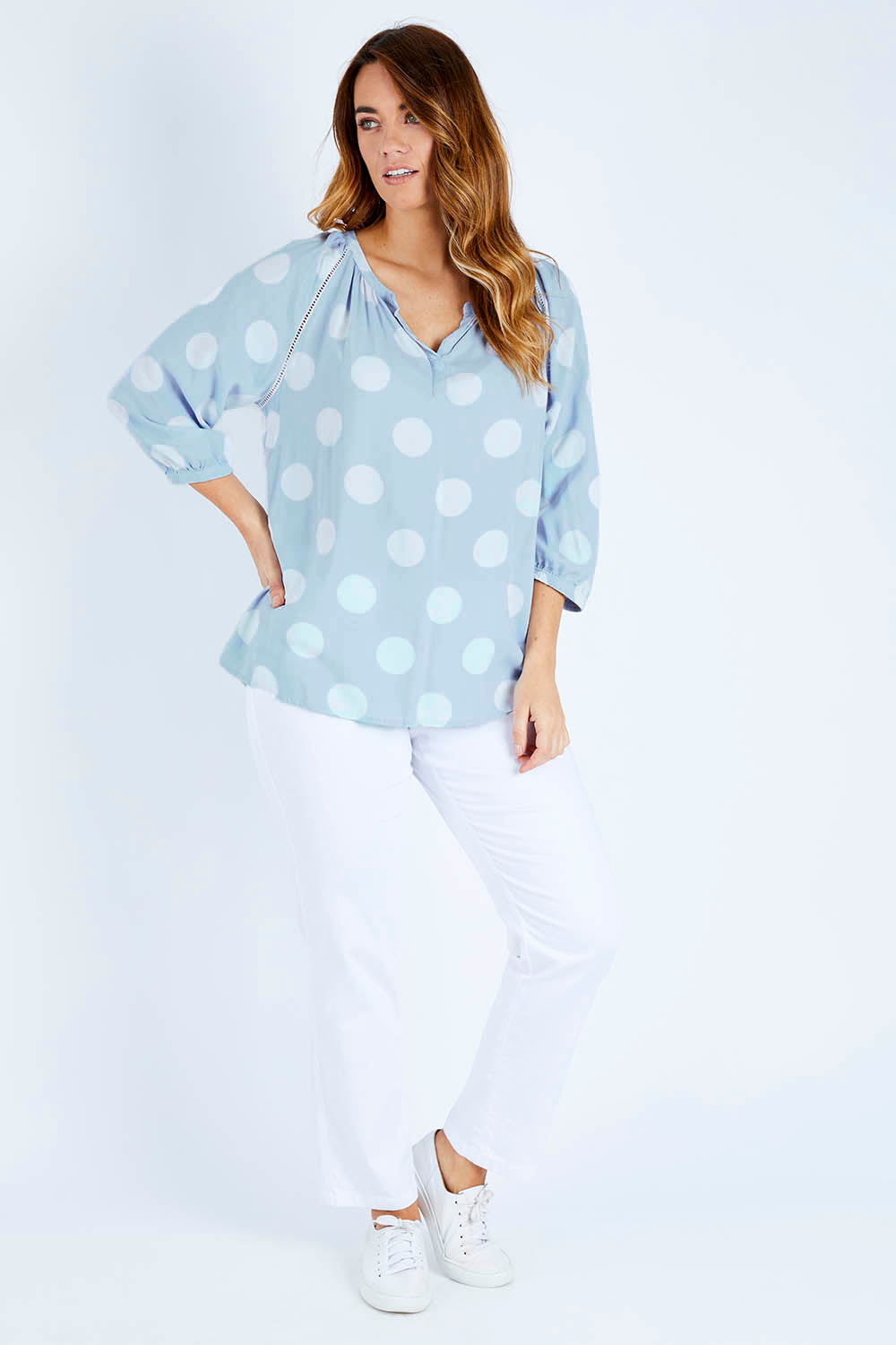 Model Laura wearing size 14 of The Stitch Detail Blouse in colour Chambspot (Blue), from the front, showing the whole outfit