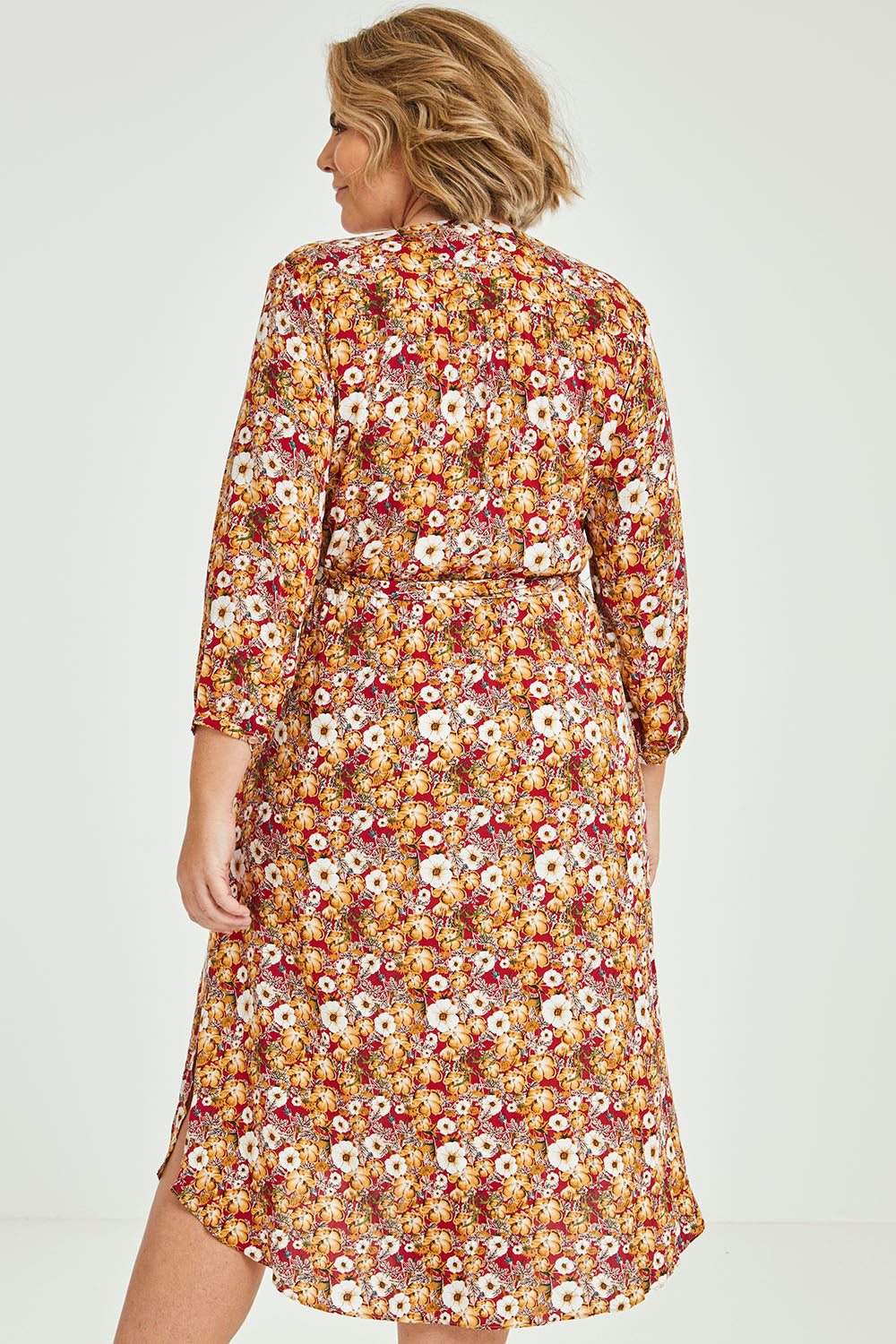 Model Fiona wearing size 16 of The Wrap Front Midi Dress in colour Redfloral (Red), from the back