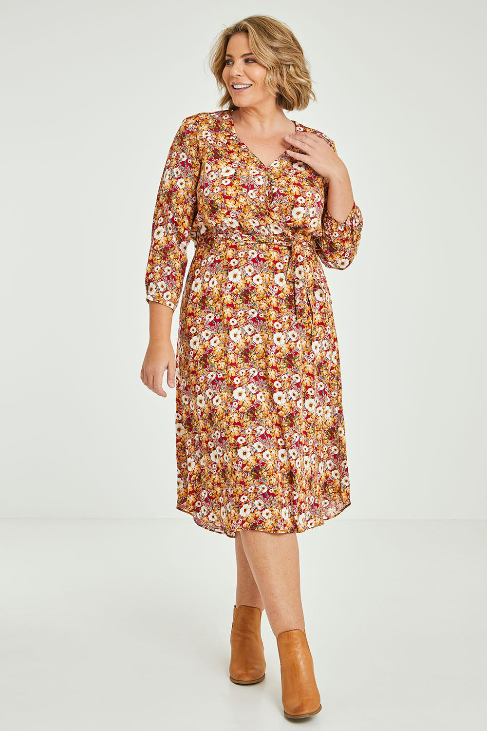 Model Fiona wearing size 16 of The Wrap Front Midi Dress in colour Redfloral (Red), from the front, showing the whole outfit
