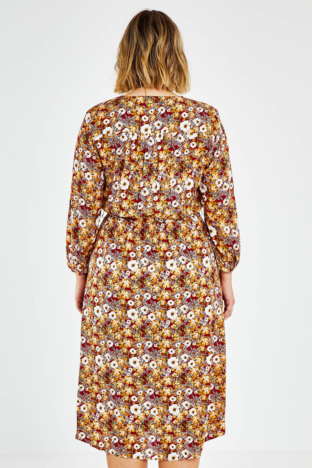 Model Jess wearing size 14 of The Wrap Front Midi Dress in colour Redfloral (Red), from the back