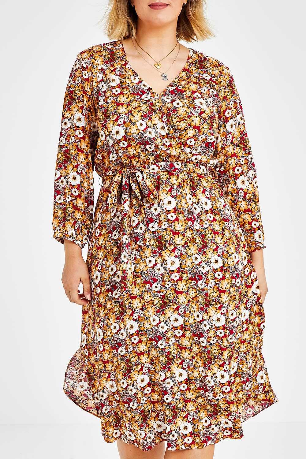 Model Jess wearing size 14 of The Wrap Front Midi Dress in colour Redfloral (Red), from the front, cropped image