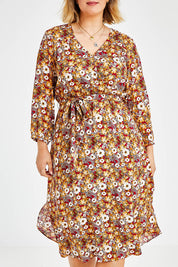 Model Jess wearing size 14 of The Wrap Front Midi Dress in colour Redfloral (Red), from the front, cropped image