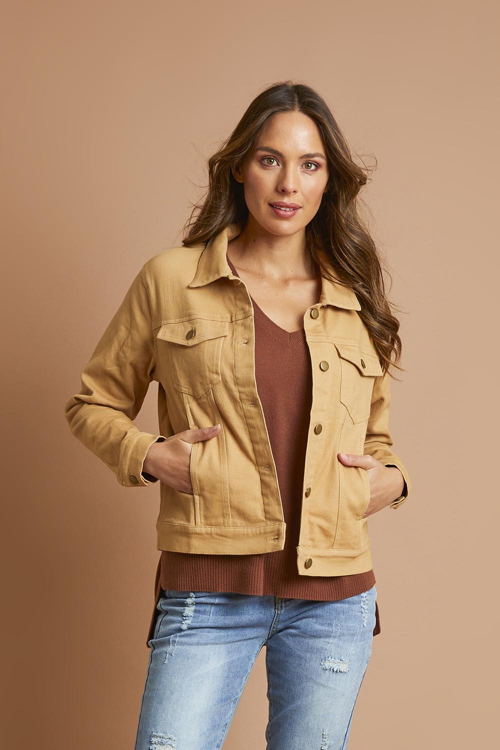 Model Madeline wearing size 10 of The Denim Jacket in colour Biscuit, from the front, showing the whole outfit