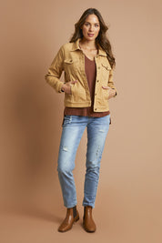 Model Madeline wearing size 10 of The Denim Jacket in colour Biscuit, from the front, showing the whole outfit