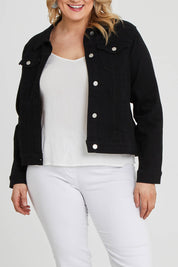 Model Keeara wearing size 16 of The Denim Jacket in colour Black (Black), from the front, cropped image
