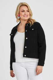 Model Keeara wearing size 16 of The Denim Jacket in colour Black (Black), from the front, cropped image