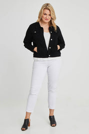 Model Keeara wearing size 16 of The Denim Jacket in colour Black (Black), from the front, showing the whole outfit