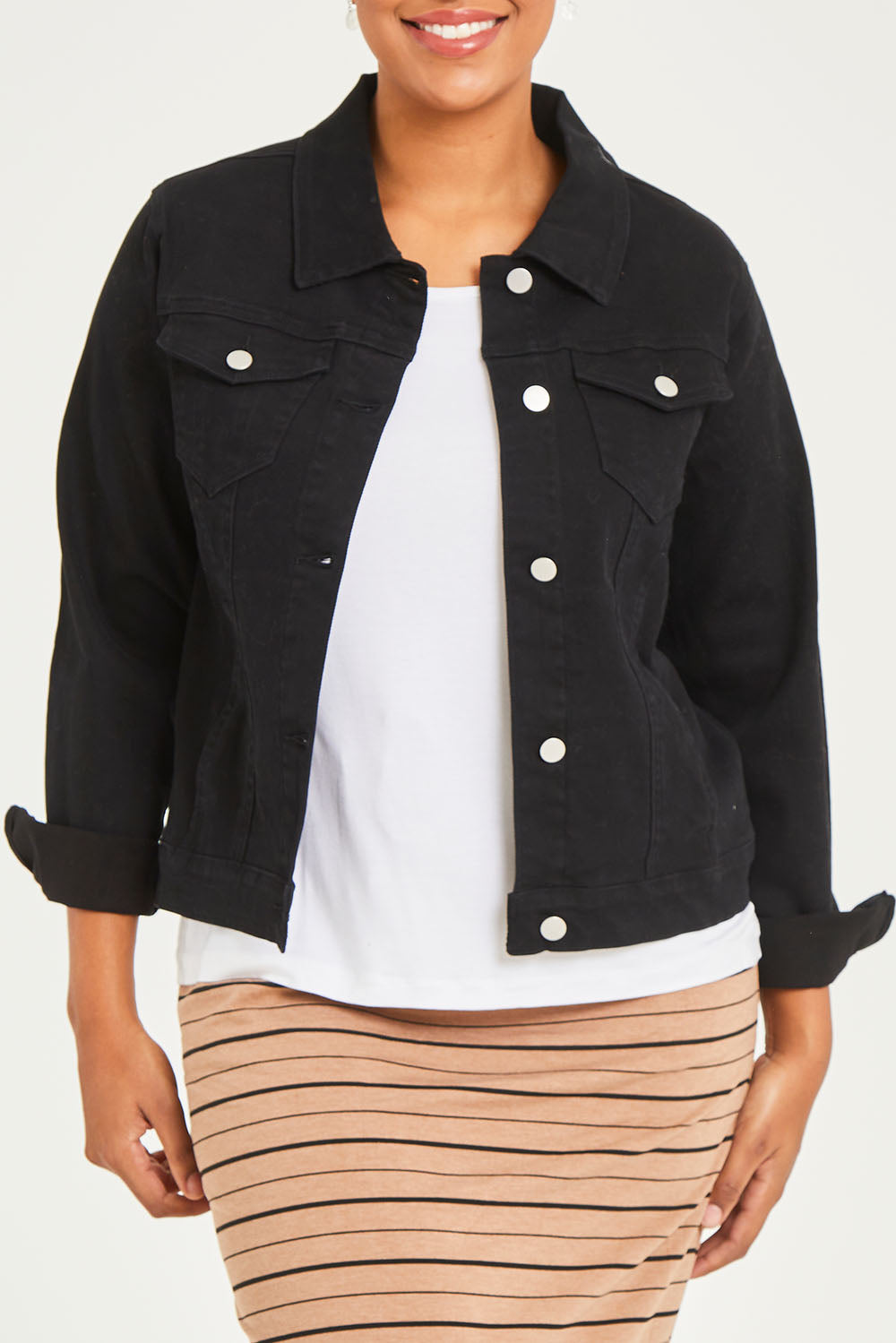 Model Noli wearing size 14 of The Denim Jacket in colour Black (Black), from the front, cropped image