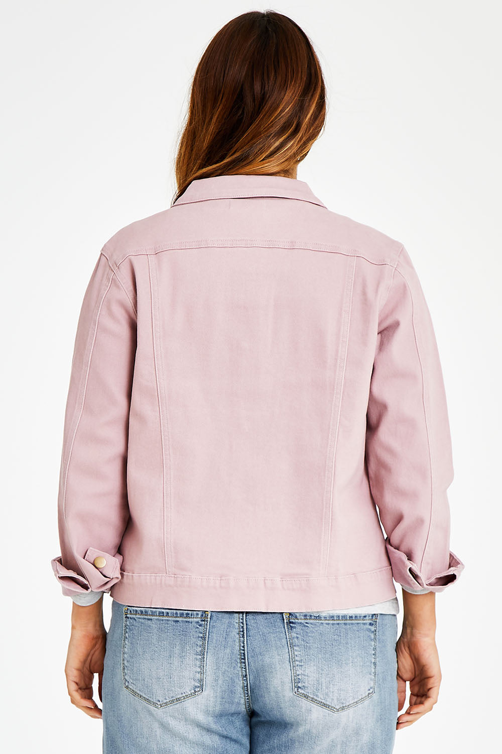 Model Laura wearing size 14 of The Denim Jacket in colour Dustypink (Pink), from the back
