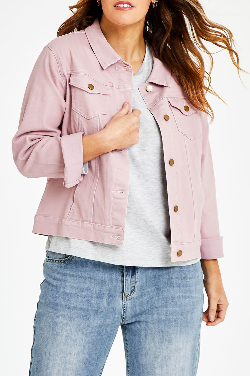 Model Laura wearing size 14 of The Denim Jacket in colour Dustypink (Pink), from the front, cropped image