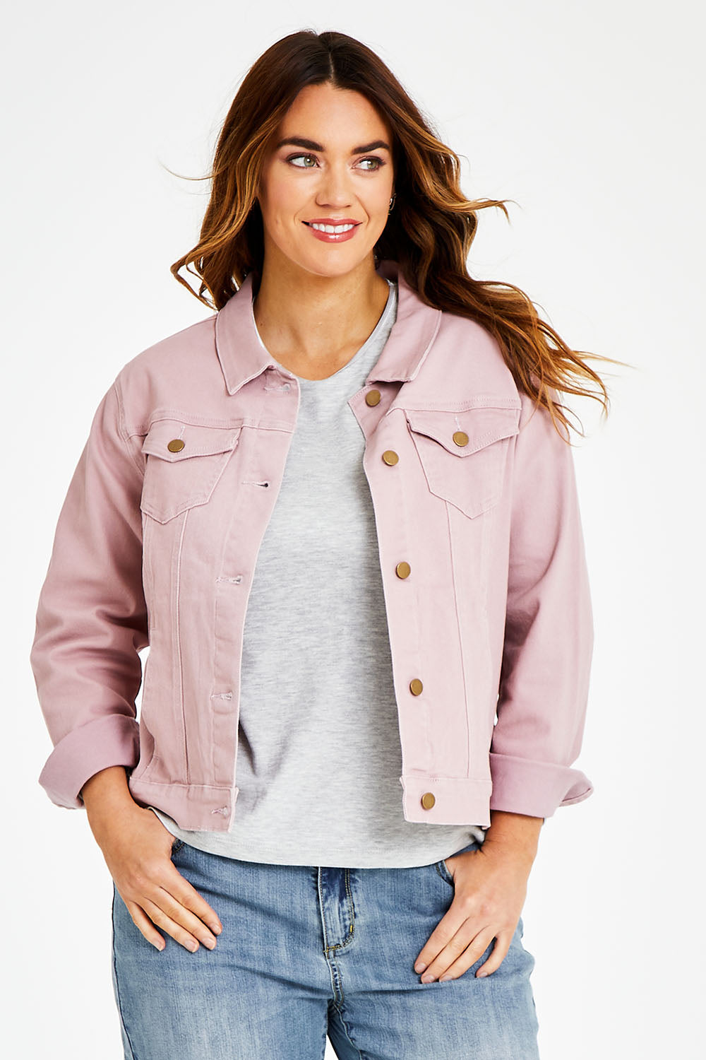 Model Laura wearing size 14 of The Denim Jacket in colour Dustypink (Pink), from the front, cropped image